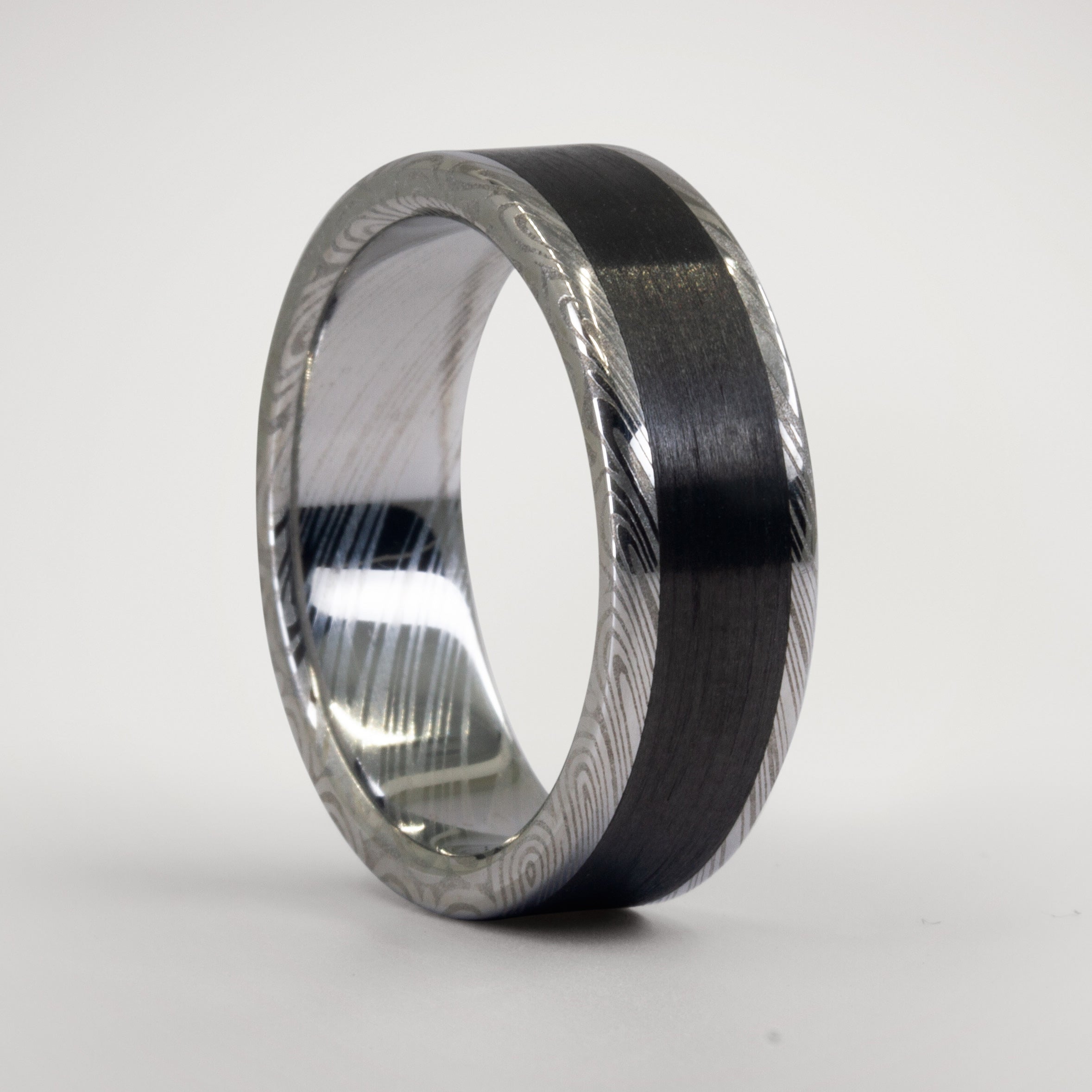 Anillo parallels acero damasco y carbon
