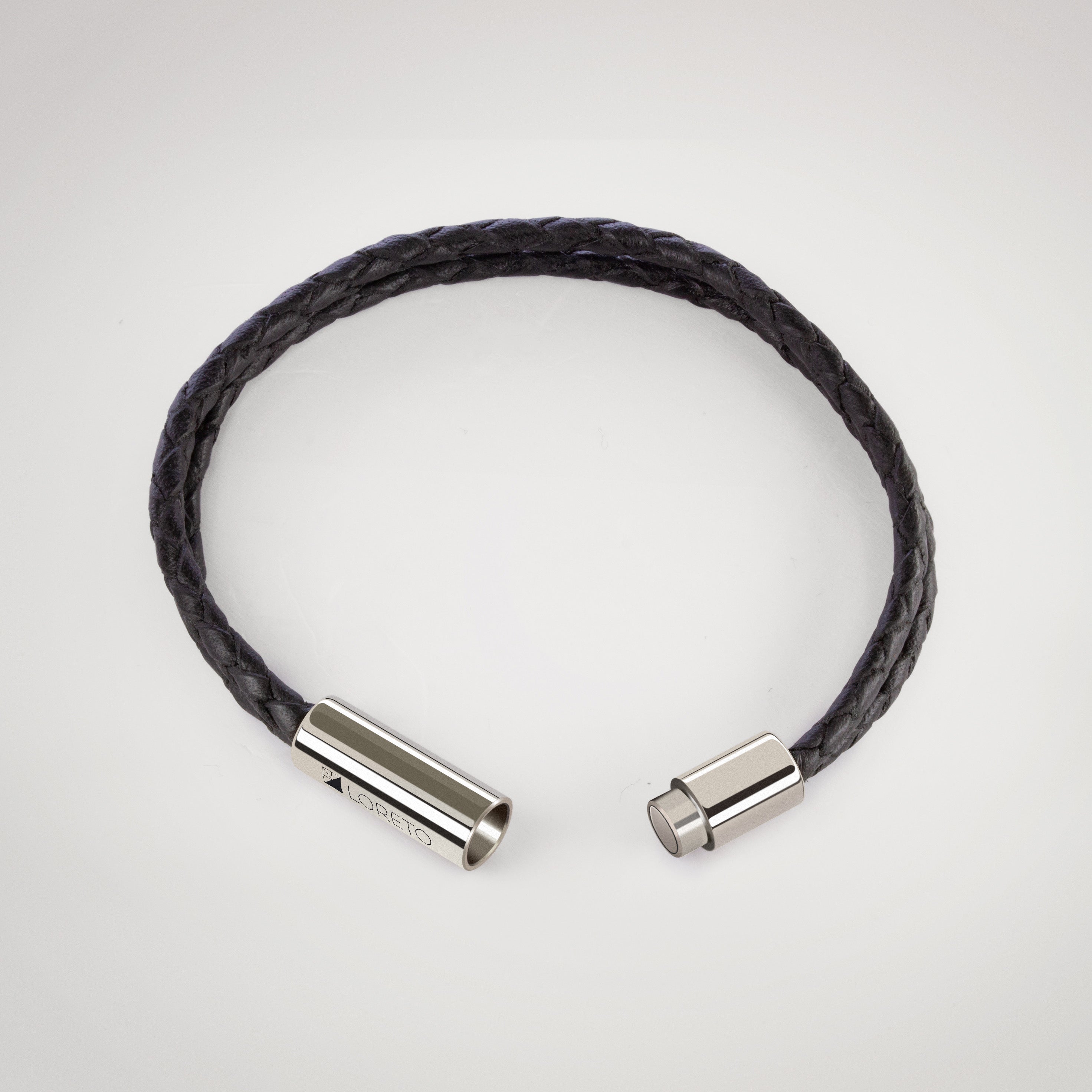 Pulsera trenza duo de cuero negro 100% argentino y titanio